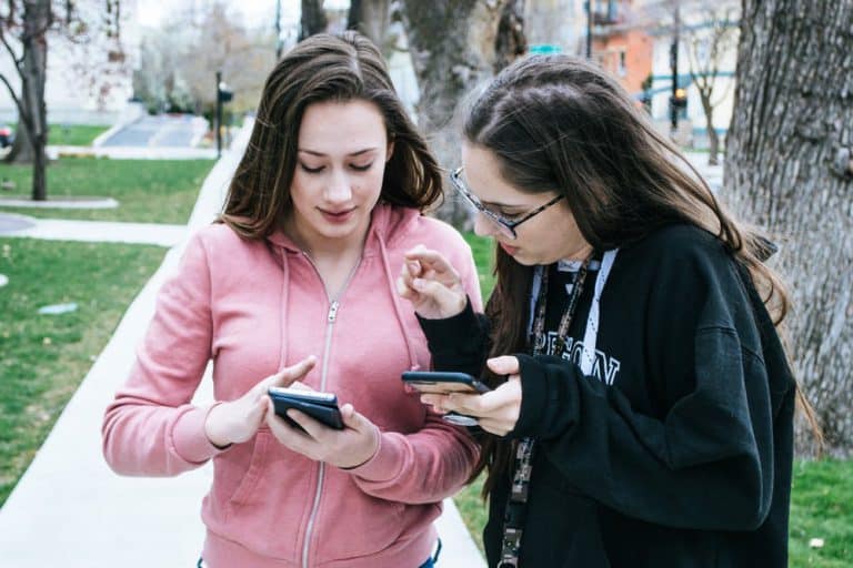 Two teenaged girls on their cell phones