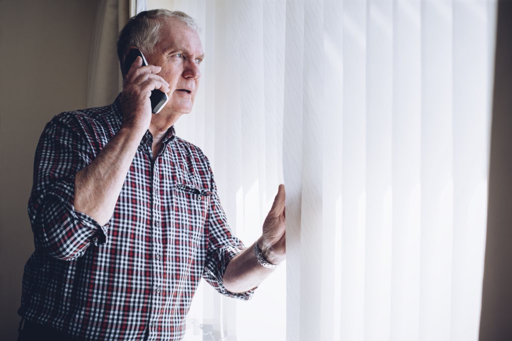 Man calling to report suspicious activity he sees through window.