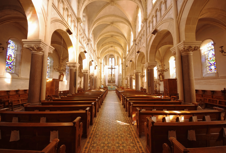 a brightly lit interior of a church